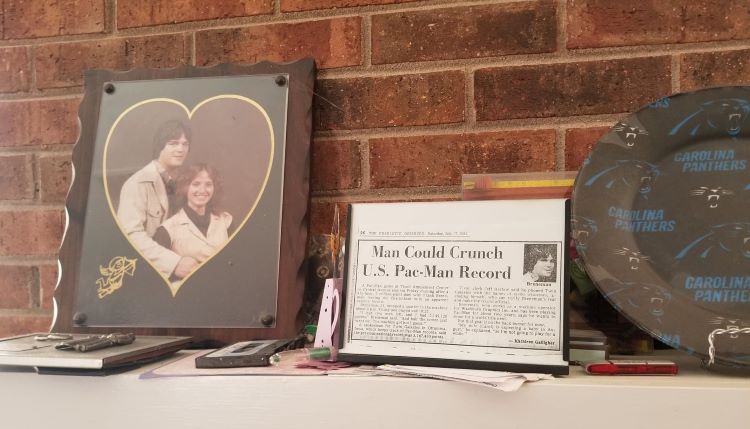 The mantel display from the Breneman household with a copy of the article announcing the Pac-Man world record [Image by Frank Breneman]
